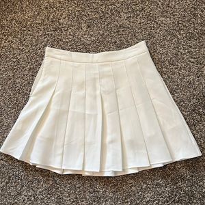 White pleated mini skirt